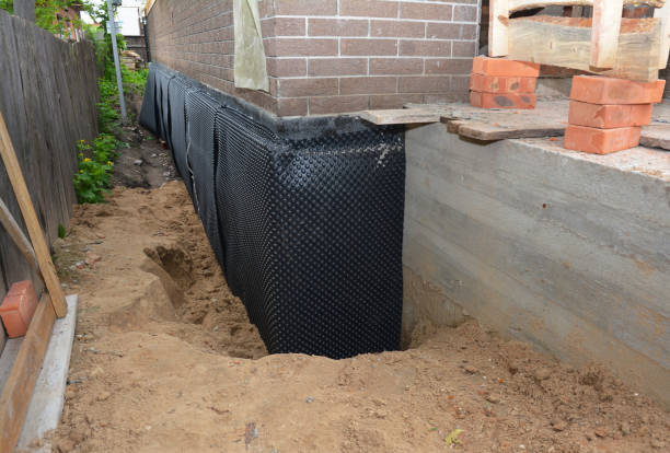 Happy homeowners after waterproofing job in Hudsonville